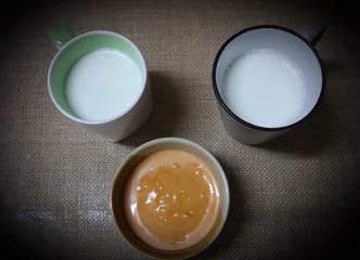 Obraz na płótnie Canvas eggs in a cup Milk