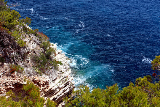 Top view of the cliffs and sea clear blue water. Beautiful sea background.