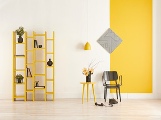 Decorative yellow and white wall concept, bookshelf and black chair.