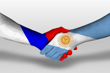 Handshake between argentina and russia flags painted on hands, illustration with clipping path.
