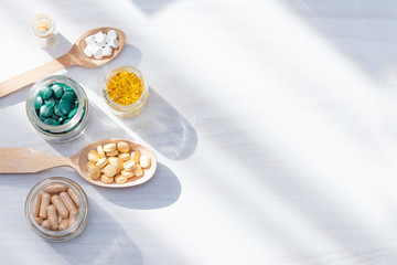 Vitamins, supplements, healthy life concept. Flat lay, copy space.