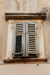 old wooden window with shutters