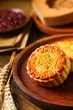 Chinese traditional mid autumn festival moon cake in wooden plate