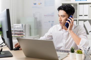 Fototapeta premium asian man speak on smartphone