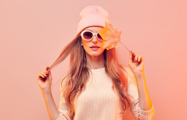 Fashionable hipster woman in Trendy autumn fall outfit, stylish hair, makeup. Blonde model in...
