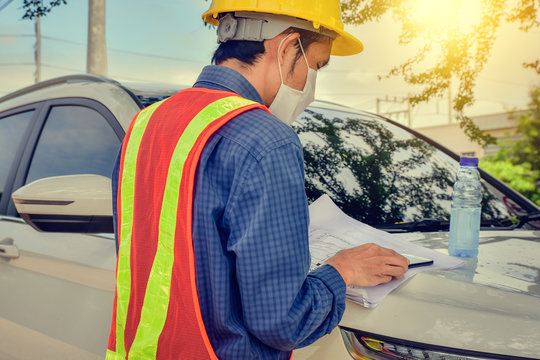 Asian Man Engineer Checking Blueprint Building Construction Project At Car On Site Outdoor,Man In Face Mask Work In New Normal