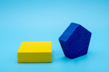 Colorful abstract geometric background with three-dimensional solid figures. Pyramid Dodecahedron prism rectangular cube arranged on colored paper.