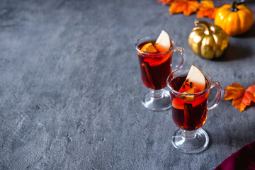Two glasses of christmas mulled wine with oranges and spices. Winter drink traditional for the Christmas holidays.