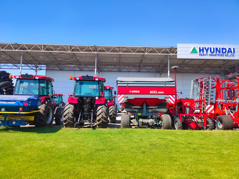Kyiv, Ukraine - June 16, 2020: Tractor and Unia cultivator on the field for minimum-tillage technology at Kyiv, Ukraine