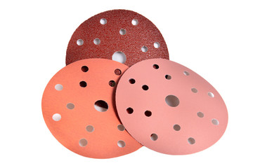 red paper sanding disc for quick release holder for angle grinder isolated on white background