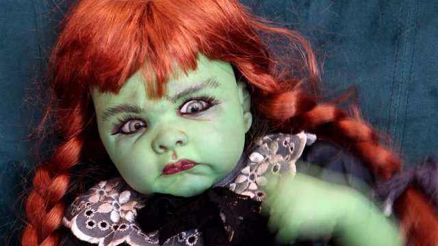 Scary Green Halloween Dolls Lifts Its Arm As If It Is Possessed 