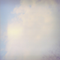 Fototapeta premium Grunge image of sky with a cloud on grainy film texture