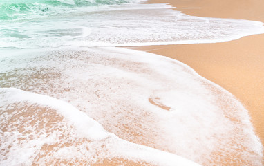 Soft wave sea on sand beach for background summer travel holidays.