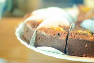 Triangle slices of delicious dark chocolate chip brownies in showcase.