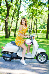 Fototapeta na wymiar girl with a retro scooter