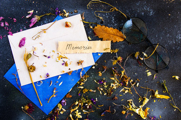 Envelope and autumn dried plants and flowers, memories word on the paper