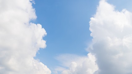 Scenic sky panorama background. Blue sky with fluffy white clouds. Copy space