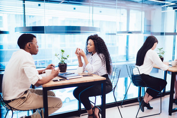 Black couple sitting in cafe