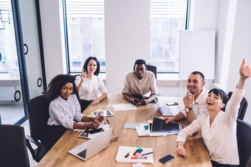 Successful coworkers having fun in conference room