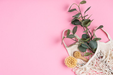 Eco-friendly kitchen accessories on pink background. The concept zero waste and our planet.