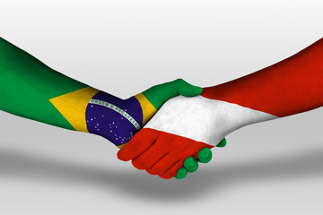 Handshake between austria and brazil flags painted on hands, illustration with clipping path.