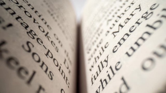 Macro footage of words on pages of a book
