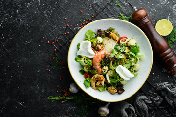 Seafood salad: mussels, shrimp, squid. Top view. Free space for text.