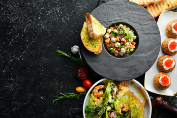 Food background. Dishes of European cuisine in plates. Top view. Free space for text.