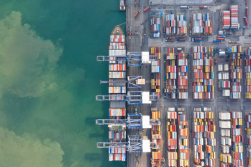 Obraz premium Container , container ship in export and import business and logistics. Shipping cargo to harbor by crane. Water transport International. Aerial view and top view.