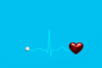 The image of the heart rate of a red heart on a blue background is isolated. The concept of a...