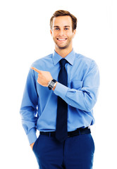 Portrait image of businessman showing something, isolated over white background. Success in business, job and education concept. Pointing confident man dressed in blue shirt and tie, at studio.