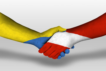 Handshake between austria and ukraine flags painted on hands, illustration with clipping path.