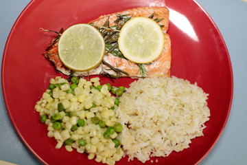 Baked salmon fillets with quinoa rice blend and corn with green beans.