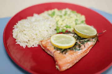 Baked salmon fillets with quinoa rice blend and corn with green beans.