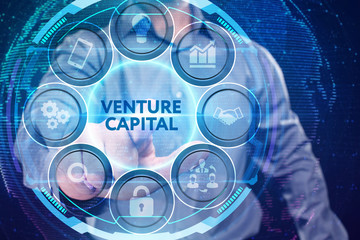 Fototapeta premium Business, Technology, Internet and network concept. Young businessman working on a virtual screen of the future and sees the inscription: