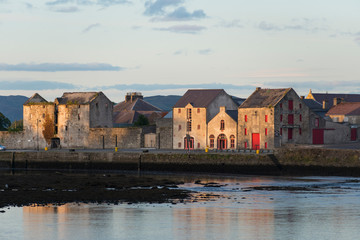 View of warehouses on the waterfront, Rathmelton, County Donegal, Ulster Province, Republic of Ireland.