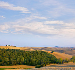 Obraz premium Beautiful landscape in Tuscany with the chapel of san quirico d orcia.