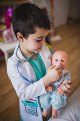 Two children playing medics at home