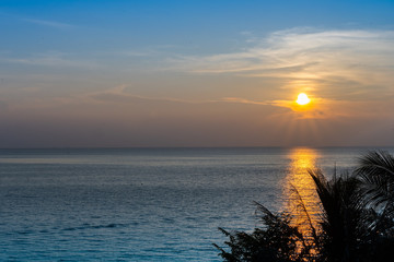 Naklejka premium Sunset over the ocean at ABC Beach, Tioman, Malaysia
