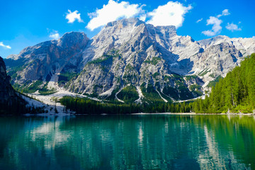 Naklejka na ściany i meble reflection of mountains in lake Brais, Dolomites
