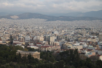 Fototapeta na wymiar Greek temple over modern Athens