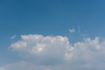 Fototapeta na wymiar Beautiful clouds floating on the blue sky with copy space.
