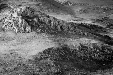 black and white mountain covered with stones