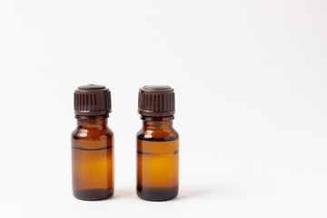 A set of amber bottles for essential oils and cosmetics. Glass bottle. Dropper, spray bottle