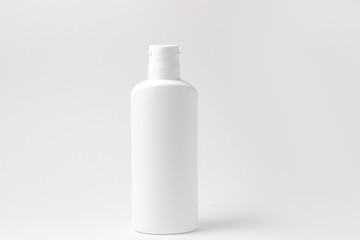 White cosmetic bottle with place to add text on white background