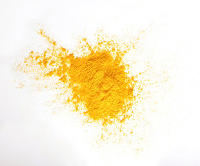 Turmeric (Curcuma) powder pile isolated on white background, top view.turmeric for indian food.