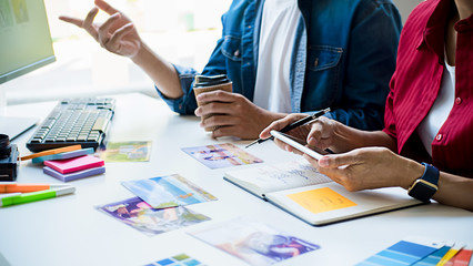Advertising agency designer creative start-up team discussing ideas in office. 