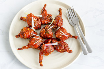 Chicken Lollipop, Popular Chicken Appetizer Directly Above Horizontal Photo on White Background
