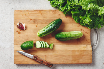 Fresh vegetables on a cutting board, salad ingredients.