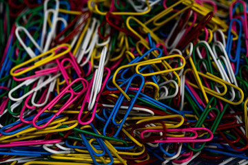 Pile of colorful paper clip. Macro close-up. Selected focus